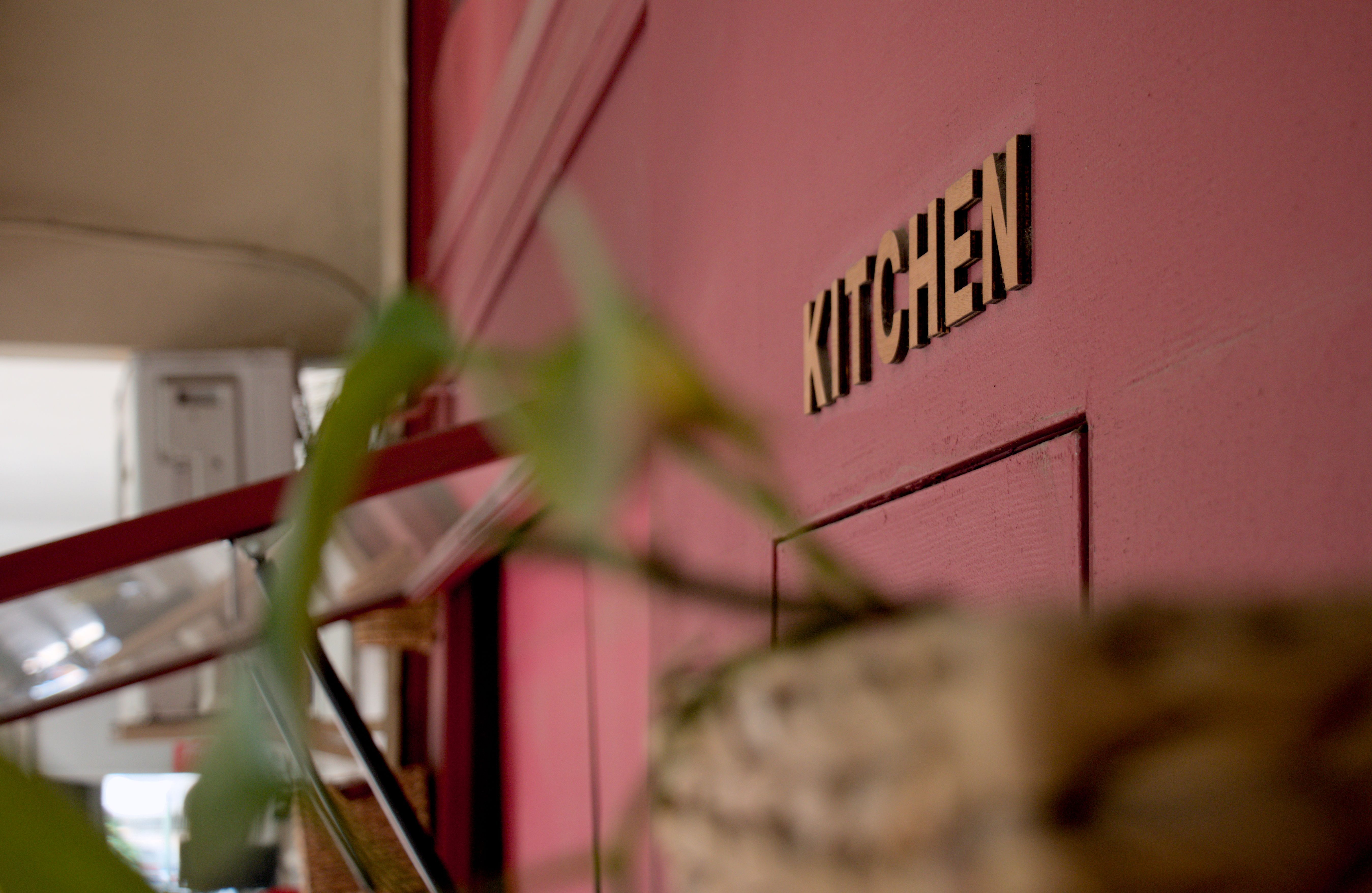 Close up, eye level view of a plate with a peinirli topped with two fried eggs.