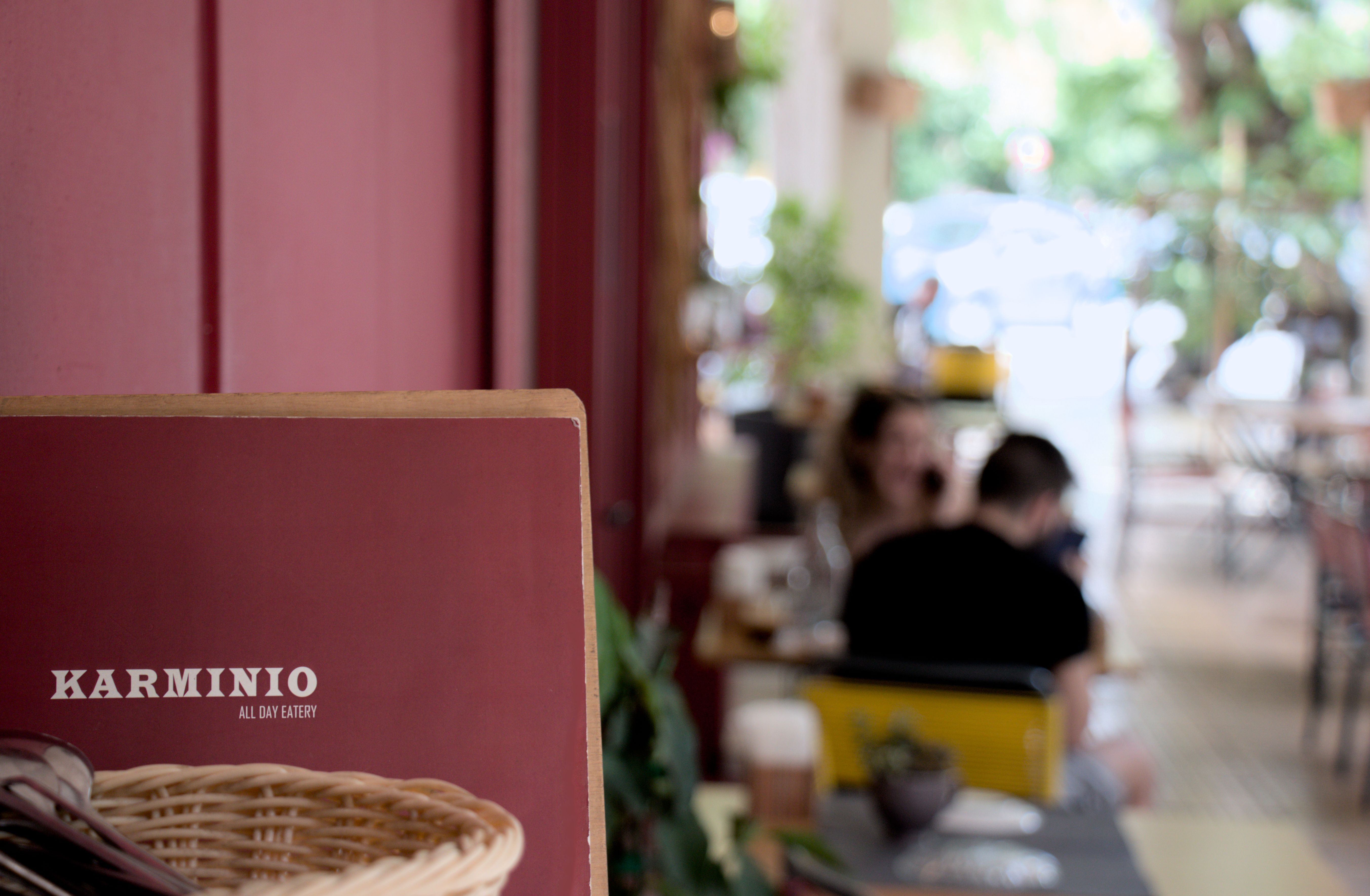 Close up, eye level view of a plate with a peinirli topped with two fried eggs.